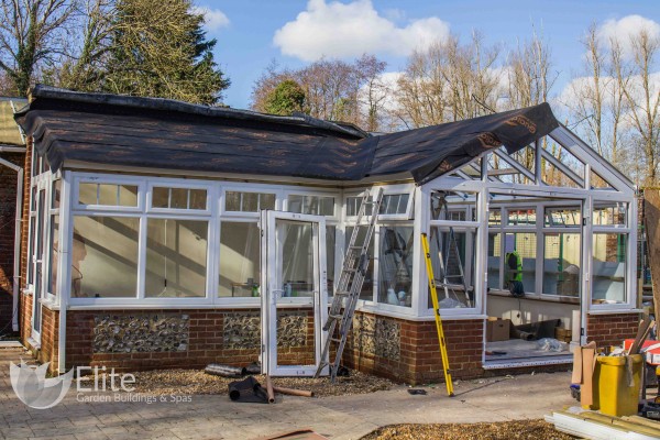 During: Work in progress with new doors and gable ends for the Guardian warm roof a replacement conservatory roof. On display at Eastleigh, Hampshire.